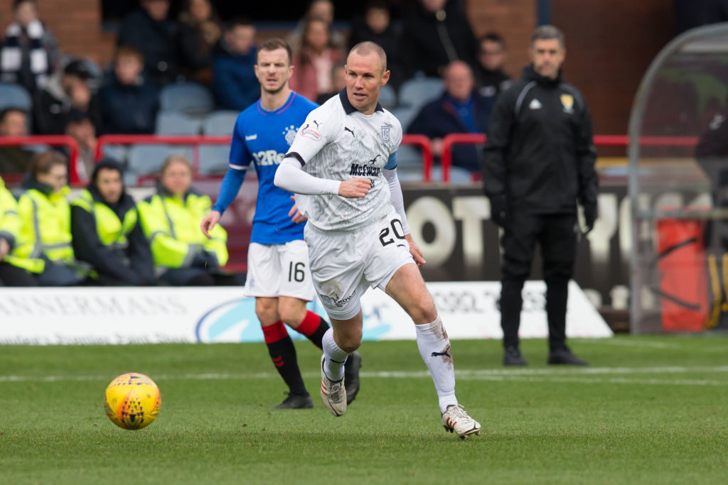 9th December 2018, Dens Park, Dundee, Scotland; Ladbrokes Premiership football, Dundee versus Rangers; Kenny Miller of Dundee strides away from Andrew Halliday of Rangers (photo by David Young/Action Plus via Getty Images)