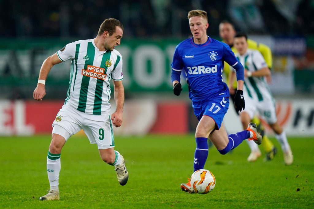 VIENNA, AUSTRIA - DECEMBER 13: Veton Berisha of Rapid and Ross McCrorie of Rangers during the UEFA Europa League match between SK Rapid Wien v Rangers at Weststadion on December 13, 2018 in Vienna, Austria.