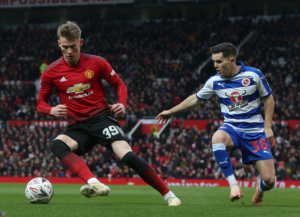 MANCHESTER, ENGLAND - JANUARY 05: Scott McTominay of Manchester United in action with Liam Kelly of Reading during the FA Cup Third Round match between Manchester United and Reading at Old Trafford on January 5, 2019 in Manchester, United Kingdom.
