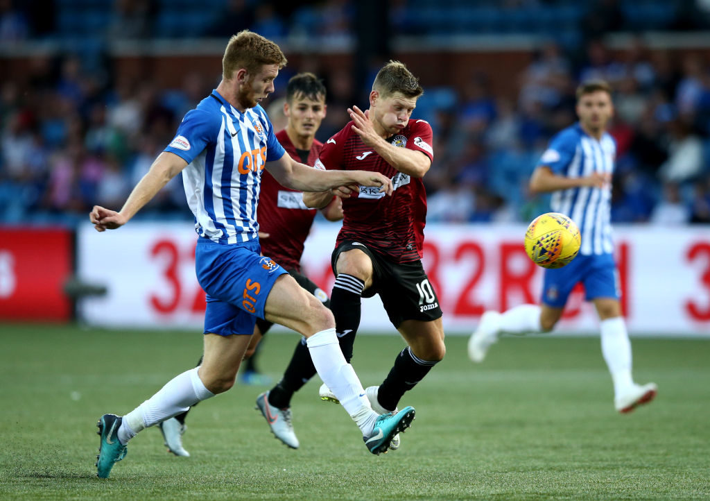 KILMARNOCK, SCOTLAND - JULY 13: Cammy Smith of St Mirren battles with Stuart Findlay of Kilmarnock FC during the Betfred Scottish League Cup match between Kilmarnock and St Mirren at Rugby Park on July 13, 2018 in Kilmarnock, Scotland.