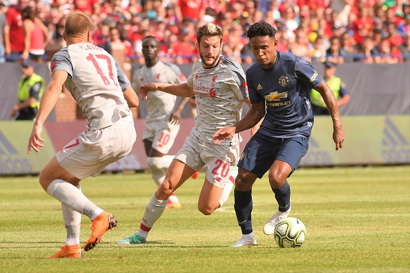 ANN ARBOR, MI - JULY 28: Manchester United Defender Demetri Mitchell (35) dribbles past Liverpool Midfielder Adam Lallana (20) in the ICC soccer match between Manchester United FC and Liverpool FC on July 28, 2018 at Michigan Stadium in Ann Arbor, MI.