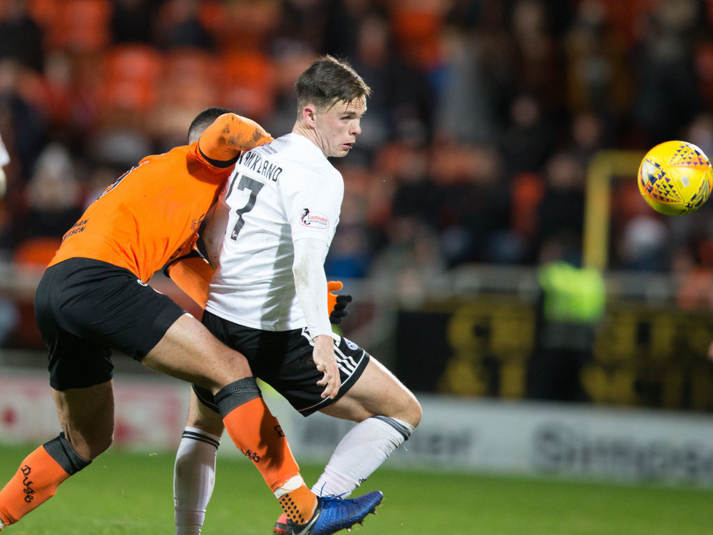 30th November 2018, Tannadice Park, Dundee, Scotland; Scottish Championship football, Dundee United versus Ayr United; Lawrence Shankland of Ayr United shrugs off the challenge of Rachid Bouhenna of Dundee United
