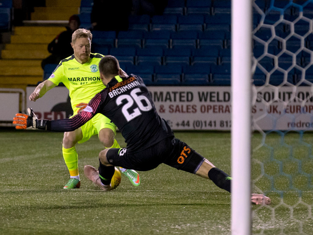 1st December 2018, Rugby Park, Kilmarnock, Scotland; Ladbrokes Premiership football, Kilmarnock versus Hibernian; Daniel Bachmann of Kilmarnock makes a save at the feet of Daryl Horgan of Hibernian