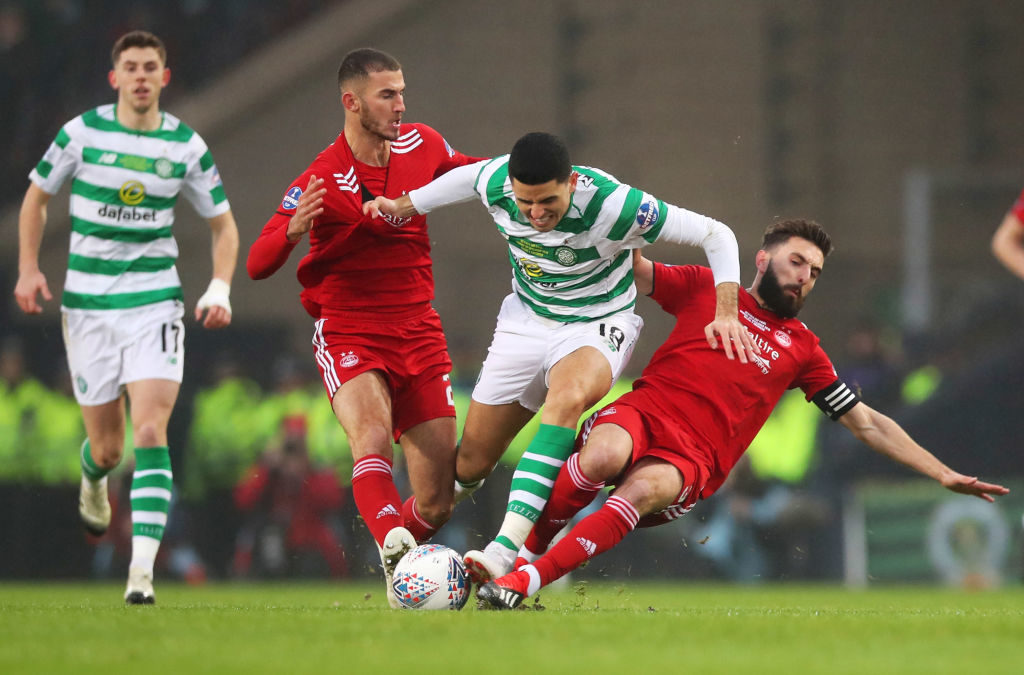 GLASGOW, SCOTLAND - DECEMBER 02: Tomas Rogic of Celtic battles with Graeme Shinnie (R) and Dominic Ball of Aberdeen (L) during the Betfred Cup Final between Celtic and Aberdeen at Hampden Park on December 2, 2018 in Glasgow, Scotland.