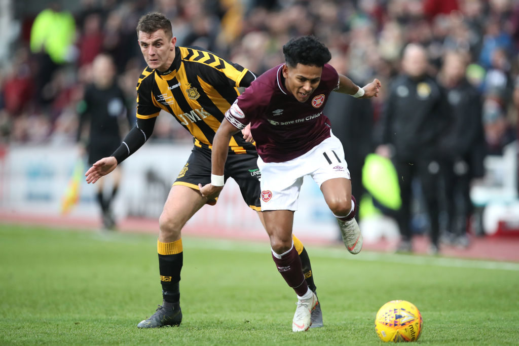 EDINBURGH, SCOTLAND - FEBRUARY 10: Demetri Mitchell of Hearts battles for possession with Stephen Wilson of Auchinleck Talbot during the Scottish Cup 5th Round match between Heart of Midlothian and Auchinleck Talbot at Tynecastle Stadium on February 10, 2019 in Edinburgh, Scotland.