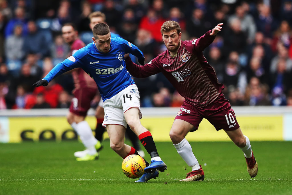 GLASGOW, SCOTLAND - FEBRUARY 16: Ryan Kent of Rangers vies with David Wotherspoon of St Johnstone during the Ladbrookes Scottish Premiership match between Rangers and St Johnstone at Ibrox Stadium on February 16, 2019 in Glasgow, Scotland.