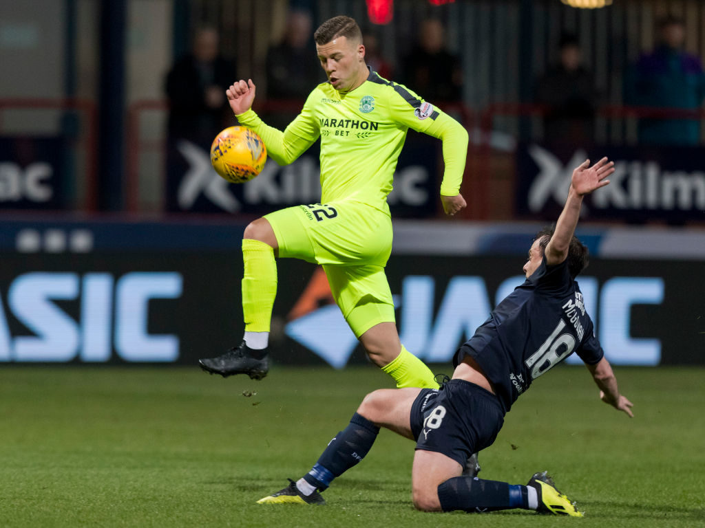 22nd February 2019, Dens Park, Dundee, Scotland; Ladbrokes Premiership football, Dundee v Hibernian; Paul McGowan of Dundee tackles Florian Kamberi of Hibernian