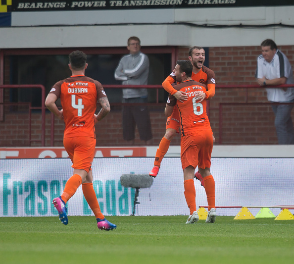 July 30th 2017, Dundee, Scotland; Scottish league Cup football, group stages, Dundee versus Dundee United; Dundee United's Paul McMullan is congratulated by Dundee United's Lewis Toshney after scoring to make it 1-0