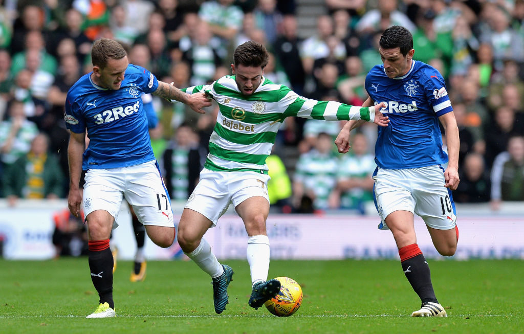 GLASGOW, SCOTLAND - SEPTEMBER 23: Patrick Roberts of Celtic attempts to get past Graham Dorrans of Rangers and Lee Hodson of Rangers during the Ladbrokes Scottish Premiership match between Rangers and Celtic at Ibrox Stadium on September 23, 2017 in Glasgow, Scotland.