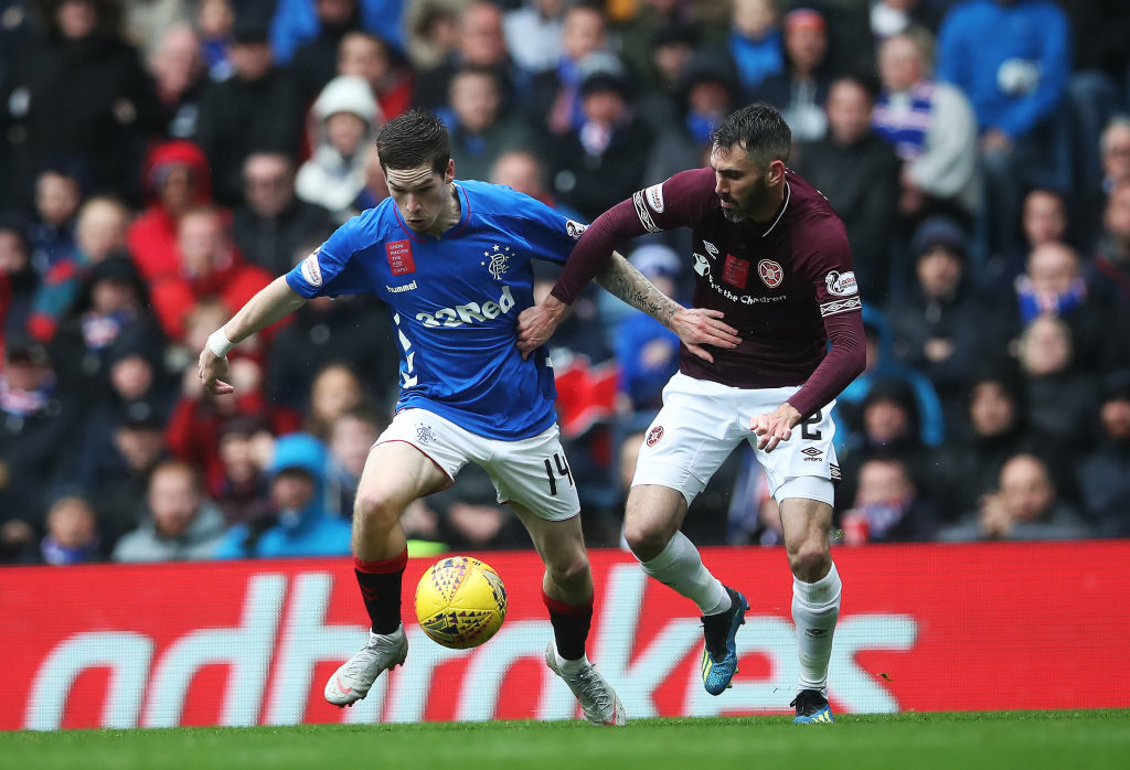 GLASGOW, SCOTLAND - OCTOBER 07: Ryan Kent of Rangers vies with Michael Smith of Heart of Midlothian during the Scottish Ladbrokes Premiership match between Rangers and Hearts at Ibrox Stadium on October 7, 2018 in Glasgow, Scotland.