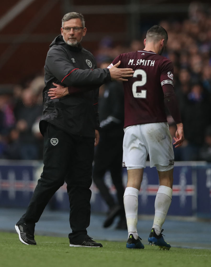 GLASGOW, SCOTLAND - OCTOBER 07: Michael Smith of Heart of Midlothian leaves the pitch after receiving his second yellow card during the Scottish Ladbrokes Premiership match between Rangers and Hearts at Ibrox Stadium on October 7, 2018 in Glasgow, Scotland.