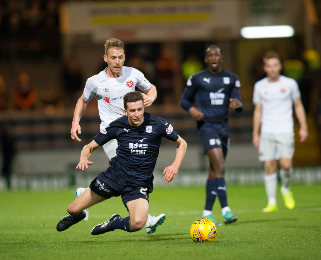 23rd October 2018, Dens Park, Dundee, Scotland; Ladbrokes Premiership football, Dundee versus Heart of Midlothian; Callumn Morrison of Heart of Midlothian brings down Cammy Kerr of Dundee