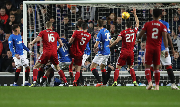GLASGOW, SCOTLAND - DECEMBER 05: Scott McKenna of Aberdeen scores the opening goal during the Scottish Ladbrokes Premiership match between Rangers and Aberdeen at Ibrox Stadium on December 5, 2018 in Glasgow, Scotland.