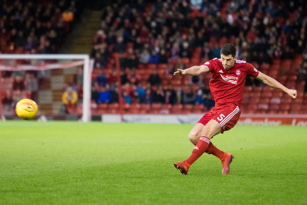 ABERDEEN, SCOTLAND - DECEMBER 08: Aberdeen Defender Scott McKenna takes a shot on goal during the Ladbrokes Premiership match between Aberdeen and St Johnstone at Pittodrie Stadium on December 8, 2018 in Aberdeen, United Kingdom.