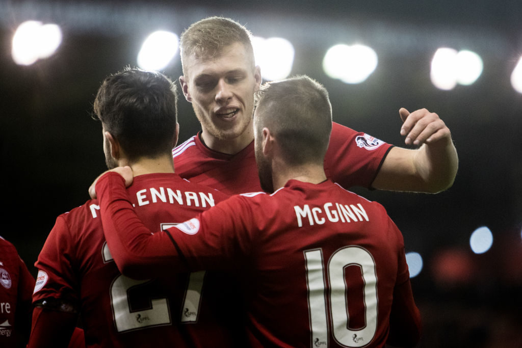 ABERDEEN, SCOTLAND - DECEMBER 18: Sam Cosgrove (centre) celebrating with teammate Connor McLennan and Niall McGinn of Aberdeen at Pittodrie Stadium on December 18, 2018 in Aberdeen, Scotland.