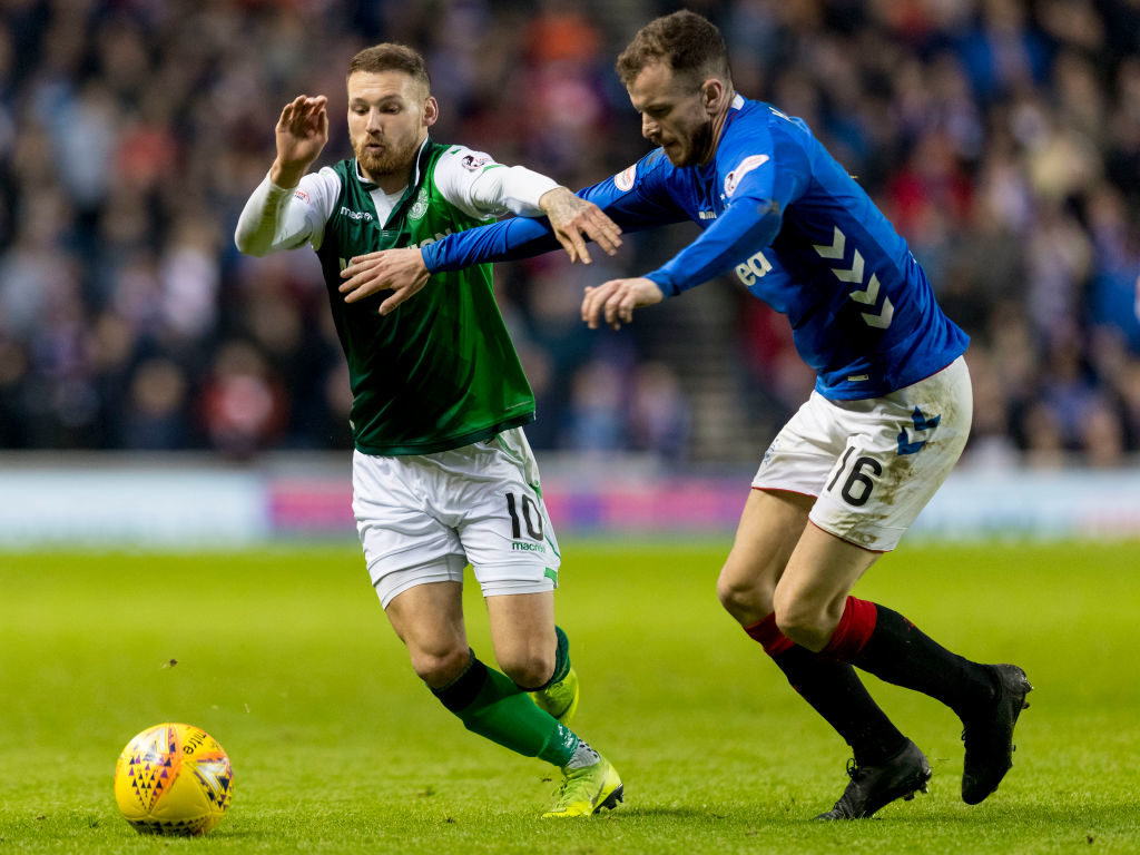 26th December 2018, Ibrox Stadium, Glasgow, Scotland; Ladbrokes Premiership football, Rangers versus Hibernian; Martin Boyle of Hibernian and Andy Halliday of Rangers compete for possession of the ball