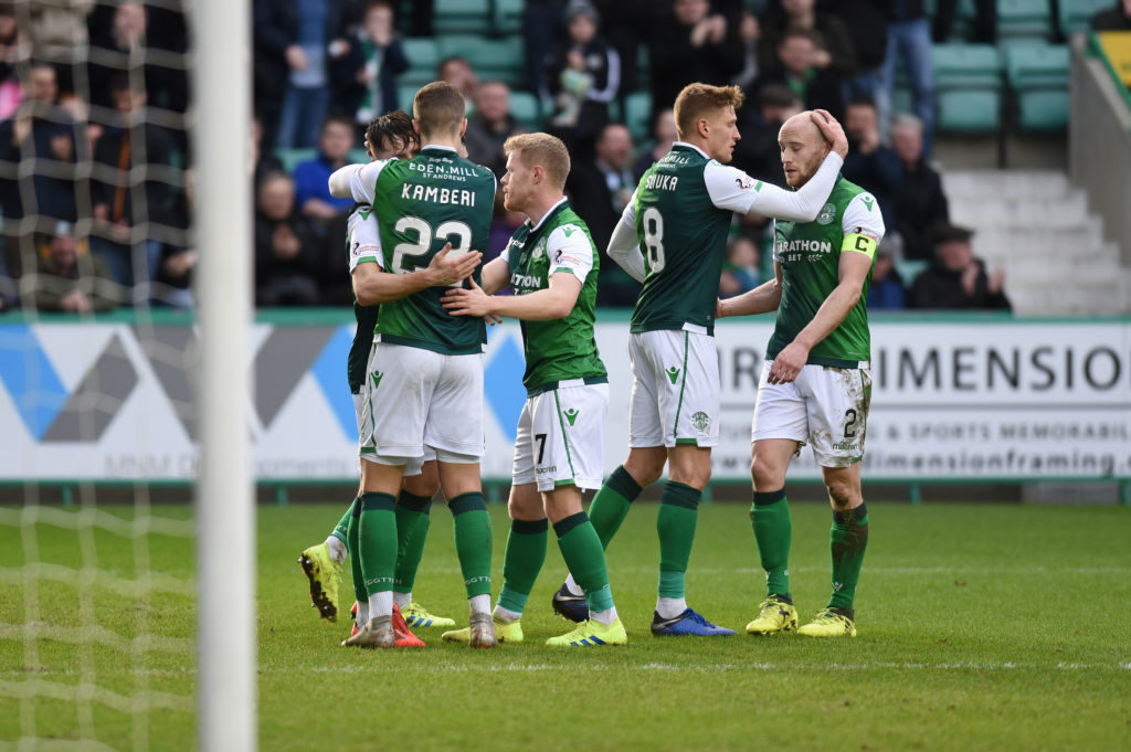 EDINBURGH, SCOTLAND - FEBRUARY 16: Hibernian FC players celebrate with penalty scorer Marc McNulty (L) of Hibernian FC during the Ladbrokes Premiership match between Hibernian and Hamilton Academical at Easter Road on February 16, 2019 in Edinburgh, United Kingdom.