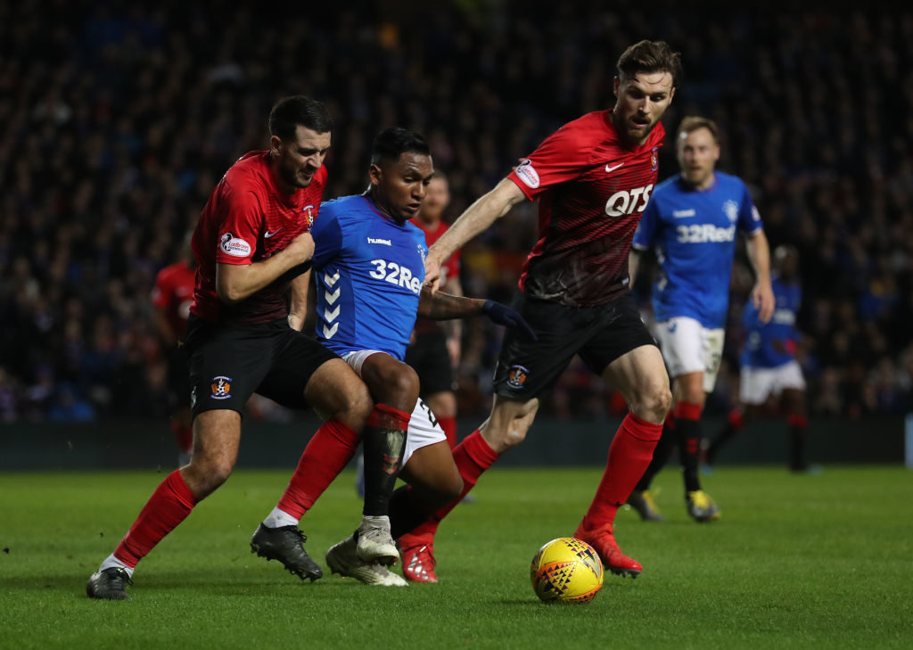 GLASGOW, SCOTLAND - FEBRUARY 20: Alfredo Morelos of Rangers vies with Gary Dicker and Stephen O'Donnell of Kilmarnock during the Scottish Cup 5th Round Replay between Rangers and Kilmarnock at Ibrox Stadium on February 20, 2019 in Glasgow, Scotland.