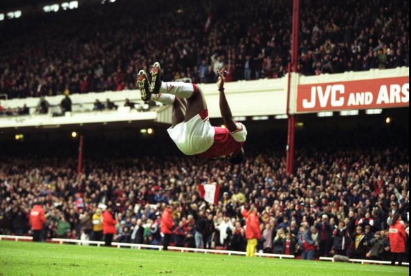 18 Apr 1998:  Christopher Wreh of Arsenal celebrates scoring a goal by showing off his gymnastic skills during the match between Arsenal v Wimbledo...