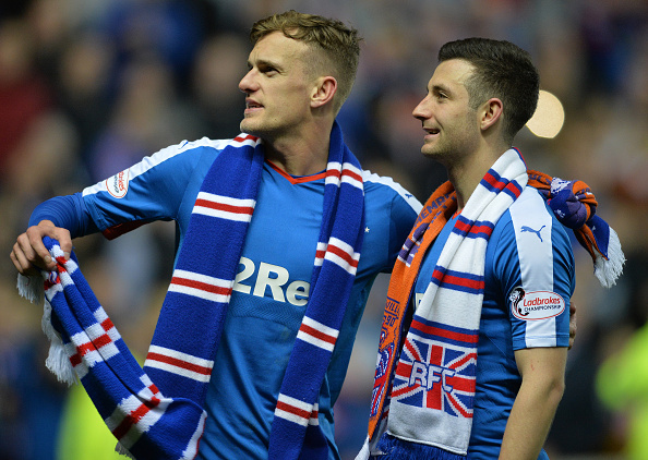 GLASGOW, SCOTLAND - APRIL 5 : Dean Shiels and Jason Holt of Rangers celebrate as Rangers beat Dumbarton 1-0 to clinch the Scottish Championship title during the match between Glasgow Rangers FC and Dumbarton FC at Ibrox Stadium on April 5, 2016 in Glasgow, Scotland.