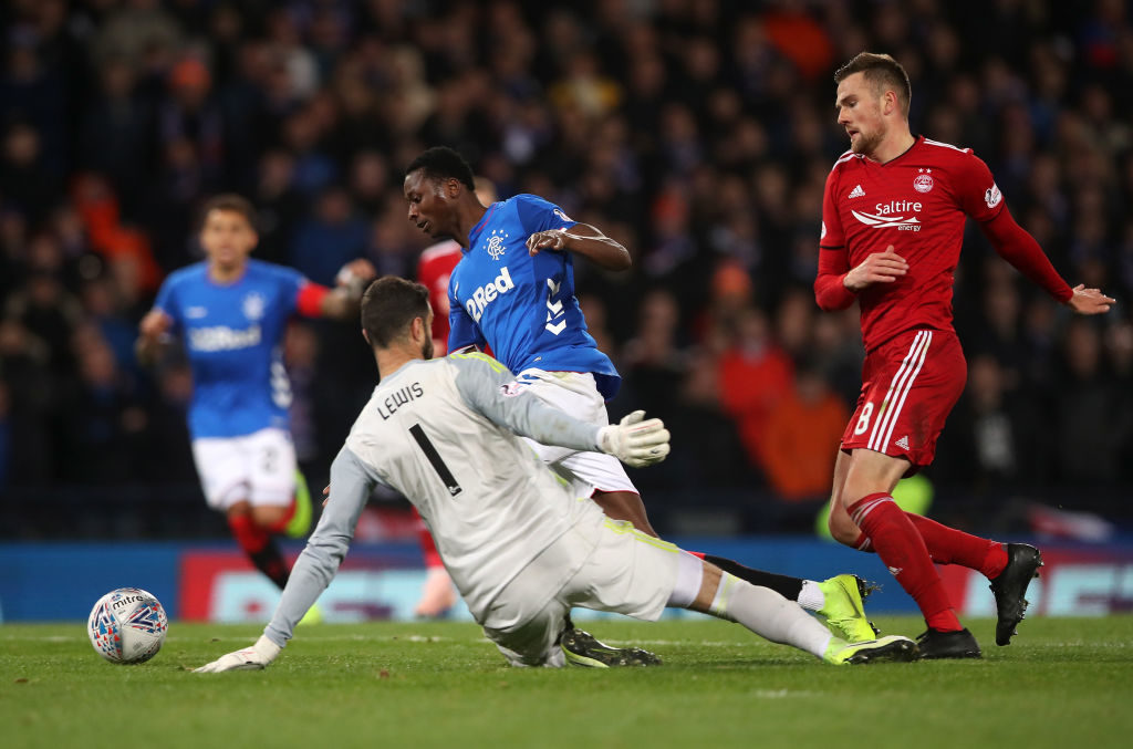 GLASGOW, SCOTLAND - OCTOBER 28: Umar Sadiq of Rangers dives in an attempt to gain a penalty under pressure from Joe Lewis of Aberdeen during the Betfred Scottish League Cup Semi Final between Aberdeen and Rangers at Hampden Park on October 28, 2018 in Glasgow, Scotland.