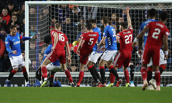 GLASGOW, SCOTLAND - DECEMBER 05: Scott McKenna of Aberdeen scores the opening goal during the Scottish Ladbrokes Premiership match between Rangers and Aberdeen at Ibrox Stadium on December 5, 2018 in Glasgow, Scotland.