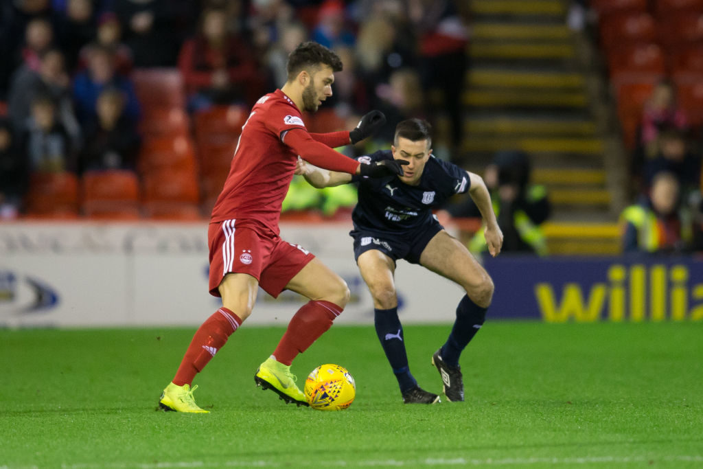 18th December 2018, Pittodrie Stadium, Aberdeen, Scotland; Ladbrokes Premiership football, Aberdeen versus Dundee; Connor McLennan of Aberdeen takes on Cammy Kerr of Dundee
