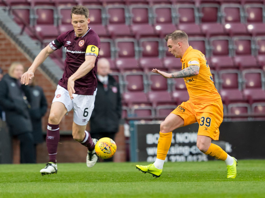 20th January 2019, Tynecastle Park, Edinburgh, Scotland; Scottish Cup football fourth round, Heart of Midlothian versus Livingston; Gregg Wylde of Livingston takes on Christophe Berra of Hearts
