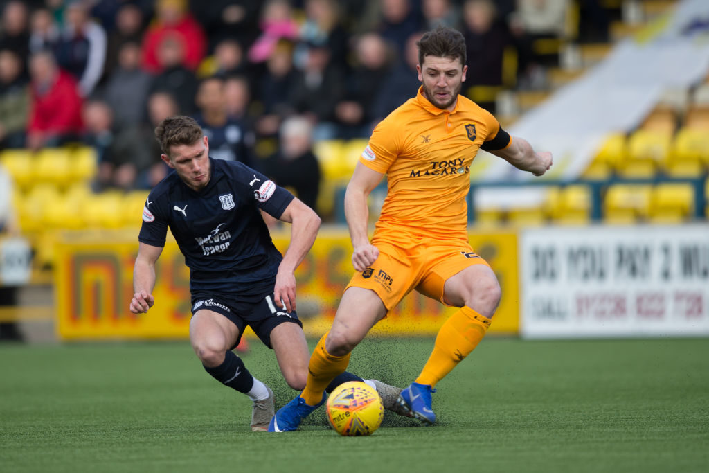 16th February 2019, Tony Macaroni Arena, Livingston, Scotland; Ladbrokes Premiership football, Livingston versus Dundee; Craig Halkett of Livingston challenges for the ball with Andy Dales of Dundee