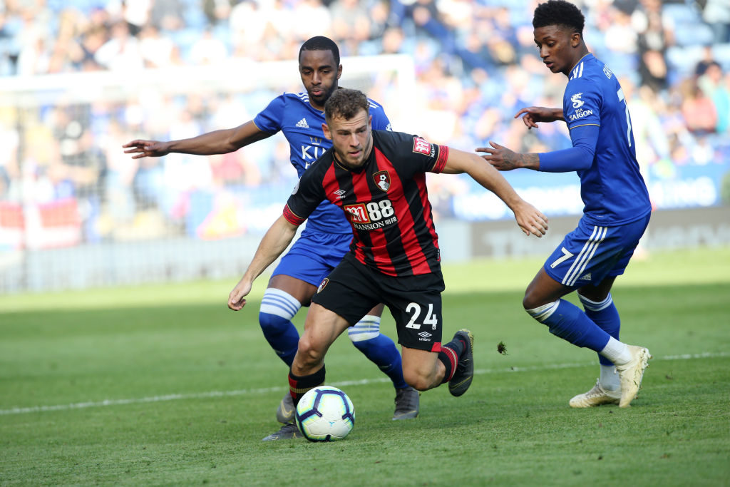 LEICESTER, ENGLAND - MARCH 30: Ricardo Pereira of Leicester City and Demarai Gray of Leicester City in action with Ryan Fraser of Bournemouth during the Premier League match between Leicester City and AFC Bournemouth at King Power Stadium on March 30th, 2019 in Leicester, United Kingdom.