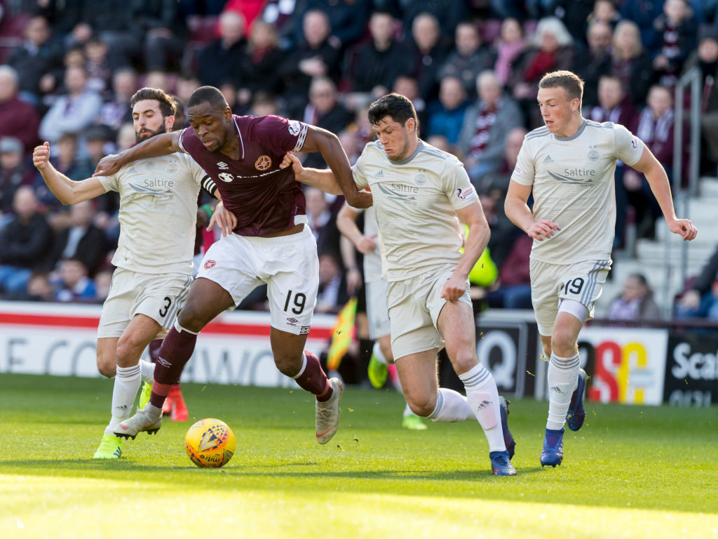 30th March 2019, Tynecastle Park, Edinburgh, Scotland; Ladbrokes Premiership football, Heart of Midlothian versus Aberdeen; Uche Ikpeazu of Hearts breaks through Aberdeen defence