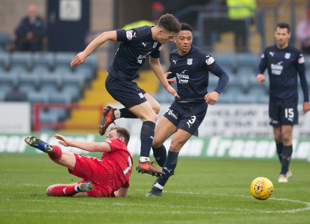 6th April 2019, Dens Park, Dundee, Scotland; Ladbrokes Premiership football, Dundee versus Aberdeen; Greg Stewart of Aberdeen is tackled by Callum Moore of Dundee