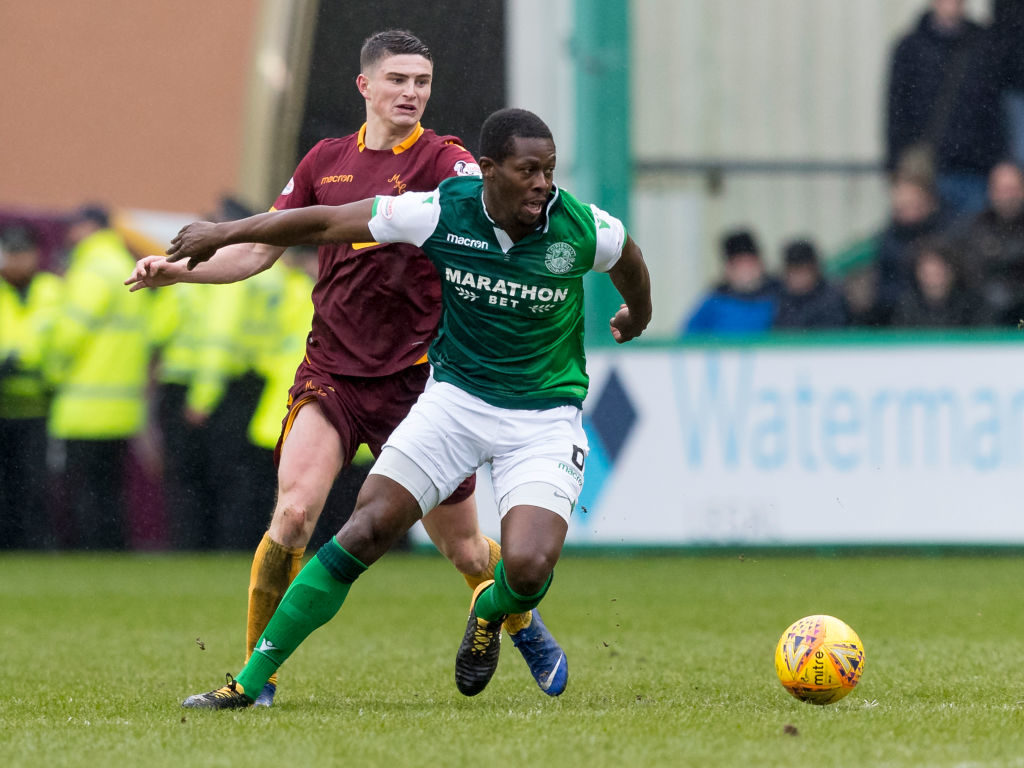 16th March 2019, Easter Road, Edinburgh, Scotland; Ladbrokes Premiership football, Hibernian versus Motherwell; Marvin Bartley of Hibernian holds back Liam Grimshaw of Motherwell