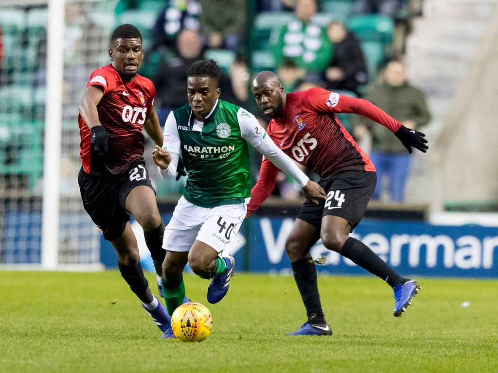 3rd April 2019, Easter Road, Edinburgh, Scotland; Ladbrokes Premiership football, Hibernian versus Kilmarnock; Stephane Omeonga of Hibernian breaks through Aaron Tshibola and Youssouf Malumba of Kilmarnock