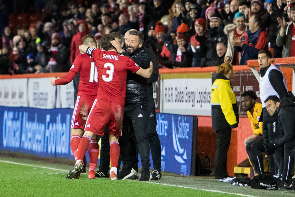ABERDEEN, SCOTLAND - APRIL 03: Niall McGinn of Aberdeen makes it 3-1 and celebrates with manager Derek McInnes and Graeme Shinnie during the Ladbrokes Scottish Premiership match between Aberdeen and Motherwell at Pittodrie Stadium on April 3, 2019 in Aberdeen, Scotland.