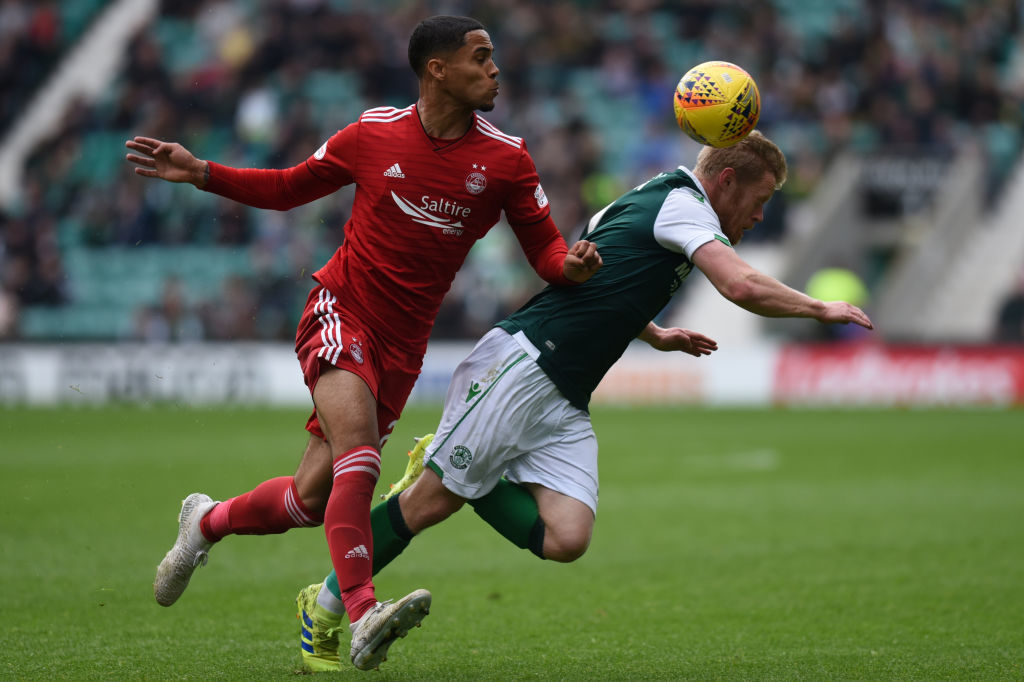 EDINBURGH, SCOTLAND - MAY 19: Max Lowe (L) of Aberdeen FC bundles Daryl Horgan of Hibernian FC over during the Ladbrokes Premiership match between Hibernian and Aberdeen at Easter Road on May 19, 2019 in Edinburgh, United Kingdom.
