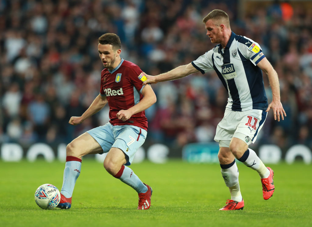 WEST BROMWICH, ENGLAND - MAY 14: John McGinn of Aston Villa holds off Chris Brunt of West Bromwich Albion during the Sky Bet Championship Play-off semi final second leg match between West Bromwich Albion and Aston Villa at The Hawthorns on May 14, 2019 in West Bromwich, England.