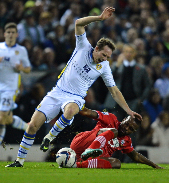 Leeds United's English midfielder Aidy White (L) vies with Southampton's Brazilian striker Guly do Prado (R) during the English League Cup Fourth Round football match between Leeds United and Southampton at Elland Road in Leeds, northern England on October 30, 2012. AFP PHOTO/ANDREW YATES RESTRICTED TO EDITORIAL USE. No use with unauthorized audio, video, data, fixture lists, club/league logos or “live” services. Online in-match use limited to 45 images, no video emulation. No use in betting, games or single club/league/player publications