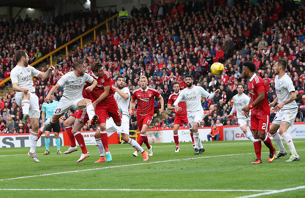 ABERDEEN, SCOTLAND - JUNE 30: Ash Taylor of Aberdeen heads at goal during the UEFA Europa League First Qualifying Round, First Leg match between Aberdeen and CS Fola Esch at Pittodrie Stadium on June 30, 2016 in Aberdeen, Scotland.
