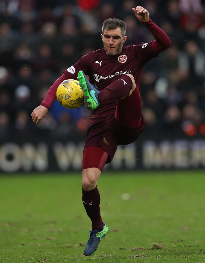 EDINBURGH, SCOTLAND - FEBRUARY 12: Aaron Hughes of Heart of Midlothian controls the ball during the Scottish Cup Fifth Round match between Heart of Midlothian and Hibernian at Tynecastle Stadium on February 12, 2017 in Edinburgh, Scotland.