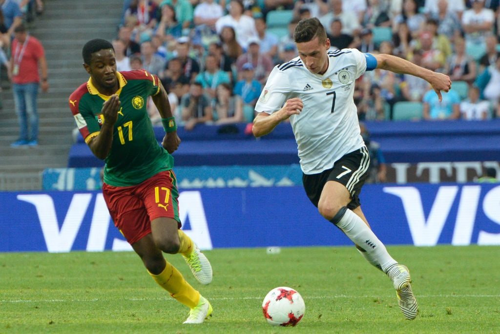 SOCHI, RUSSIA - JUNE 25: Arnaud Djoum (7) of Germany in action against Arnaud Djoum (17) of Cameroon during the FIFA Confederations Cup 2017 soccer match between Cameroon and Germany in Sochi, Russia on June 25, 2017.