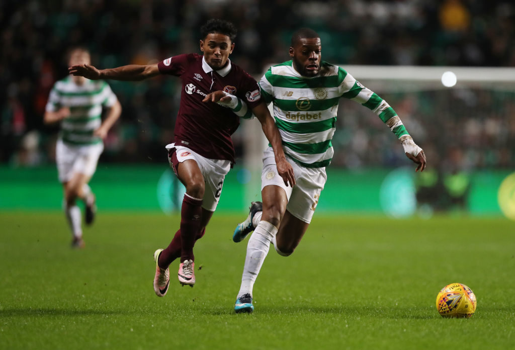 GLASGOW, SCOTLAND - JANUARY 30: Demi Mitchell of Heart of Midlothian vies with Olivier Ntcham of Celtic during the Scottish Premier League match between Celtic and Heart of Midlothian at Celtic Park on January 30, 2018 in Glasgow, Scotland.