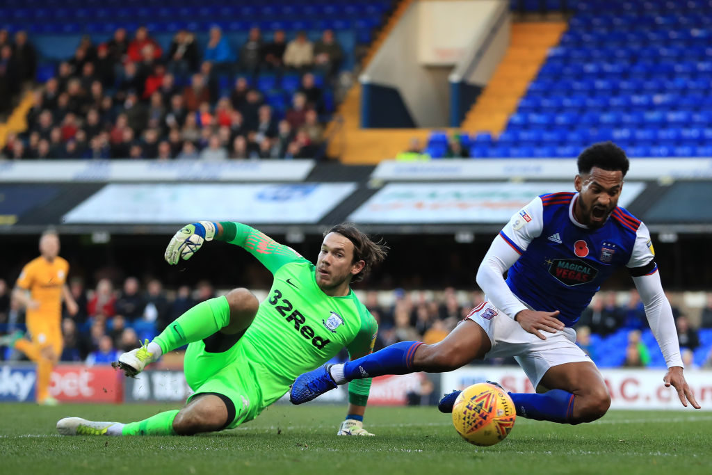 3rd November 2018, Portman Road, Ipswich, England; EFL Championship football, Ipswich Town versus Preston North End; Chris Maxwell of Preston North End fouls Jordan Roberts of Ipswich Town and gives away a penalty