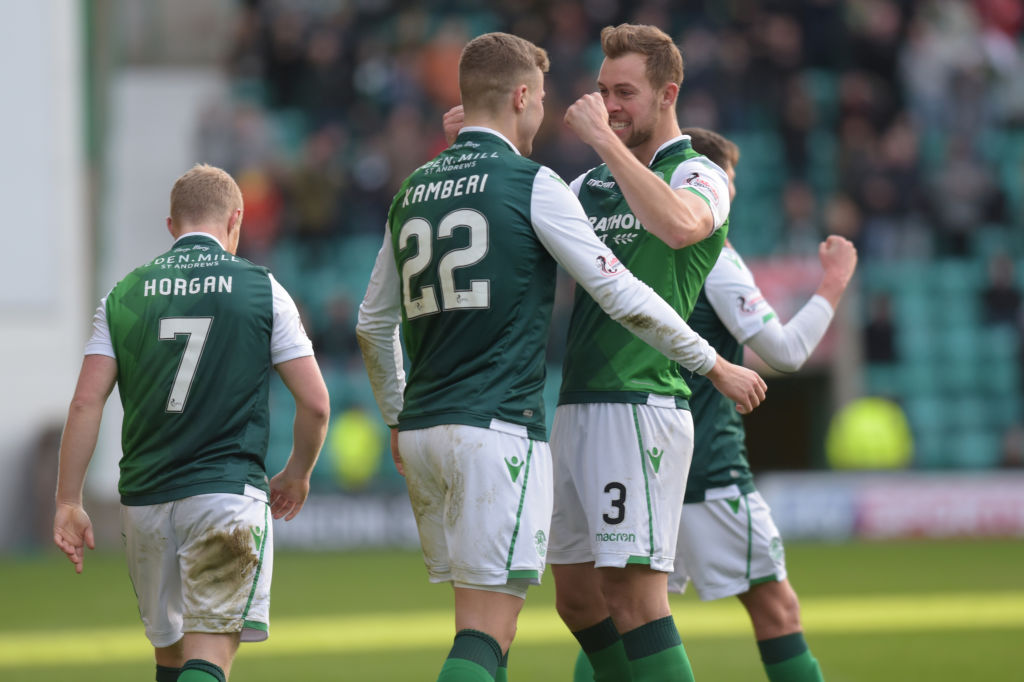 EDINBURGH, SCOTLAND - DECEMBER 16: Goal scorer Florian Kamberi of Hibs FC celebrates with defender Steven Whittaker (R) of Hibernian FC during the Ladbrokes Premiership match between Hibernian and Celtic at Easter Road on December 16, 2018 in Edinburgh, United Kingdom.