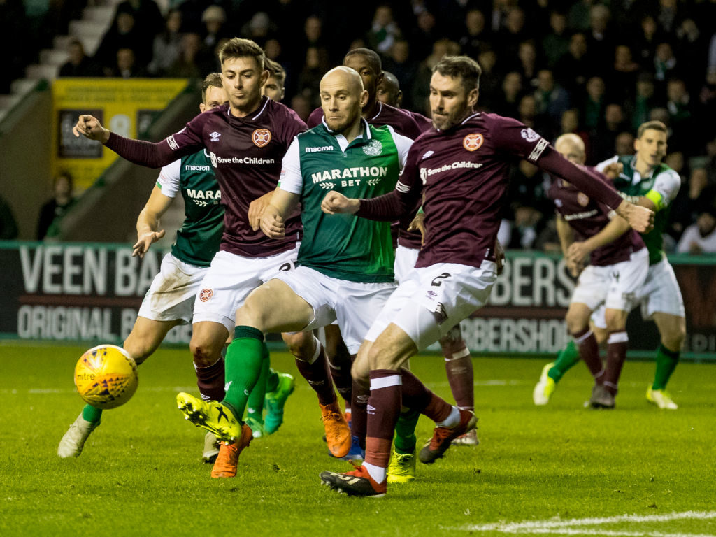 29th December 2018, Easter Road, Edinburgh, Scotland; Ladbrokes Premiership football, Hibernian versus Heart of Midlothian; Marcus Godinho and Michael Smith of Hearts box out David Gray of Hibernian