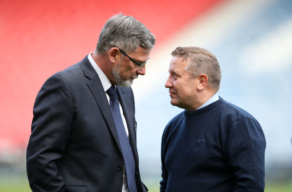 GLASGOW, SCOTLAND - APRIL 13: Craig Levein, Manager of Hearts speaks with John Robertson, Manager of Inverness Caledonian Thistle prior to the Scottish Cup Semi Final match between Heart of Midlothian and Inverness Caledonian Thistle at Hampden Park on April 13, 2019 in Glasgow, Scotland.