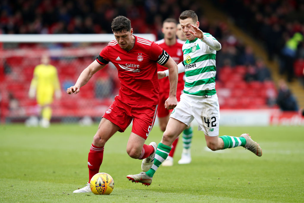 ABERDEEN, SCOTLAND - MAY 04: Scott McKenna of Aberdeen is challenged by Callum McGregor of Celtic during the Ladbrokes Scottish Premiership match between Aberdeen and Celtic at Pittodrie Stadium on May 04, 2019 in Aberdeen, Scotland.