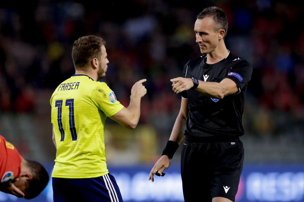 BRUSSEL, BELGIUM - JUNE 11: (L-R) Ryan Fraser of Scotland, referee Petr Adreleanu during the EURO Qualifier match between Belgium v Scotland at the Koning Boudewijn Stadium on June 11, 2019 in Brussel Belgium