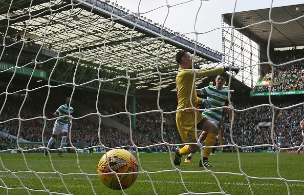 GLASGOW, SCOTLAND - SEPTEMBER 30: Ross Laidlaw of Hibernian is seen as Tomas Rogic of Celtic looks on after Callum McGregor of Celtic scores the opening goal during the Ladbrokes Scottish Premiership match between Celtic and Hibernian at Celtic Park Stadium on September 30, 2017 in Glasgow, Scotland.