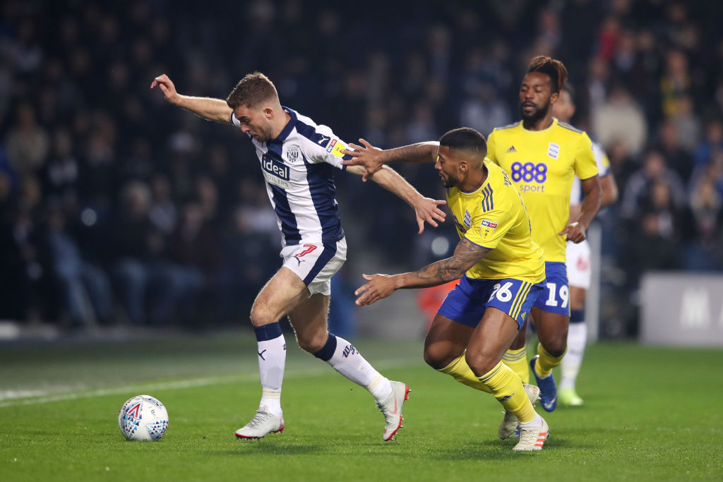 WEST BROMWICH, ENGLAND - MARCH 29: James Morrison of West Brom in action with David Davis of Birmingham during the Sky Bet Championship match between West Bromwich Albion and Birmingham City at The Hawthorns on March 29, 2019 in West Bromwich, England.